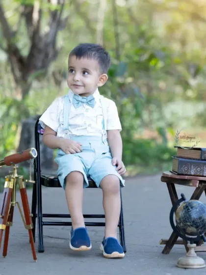 Ready to explore the world. My explorer-themed sessions, complete with a vintage telescope and globe, are perfect for capturing the adventurous spirit of curious little minds.