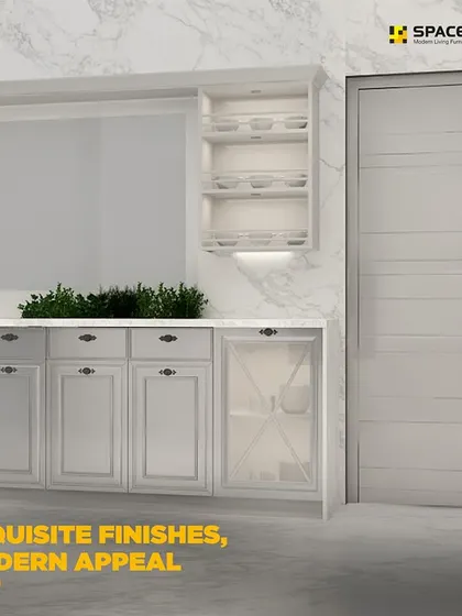 This classic kitchen design features exquisite finishes and a modern appeal. The white shaker-style cabinets with glass-fronted doors are set against a marble-patterned backsplash, creating a bright and luxurious space.