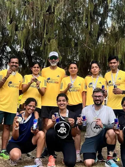 Celebrating with medals and Red Bull after a challenging and meaningful race.