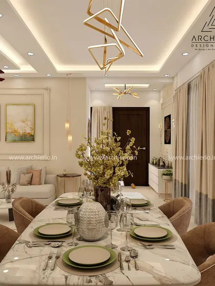 A grand dining space in a villa, featuring a marble-top table and elegant lighting. The design is perfect for hosting large gatherings in a luxurious setting.