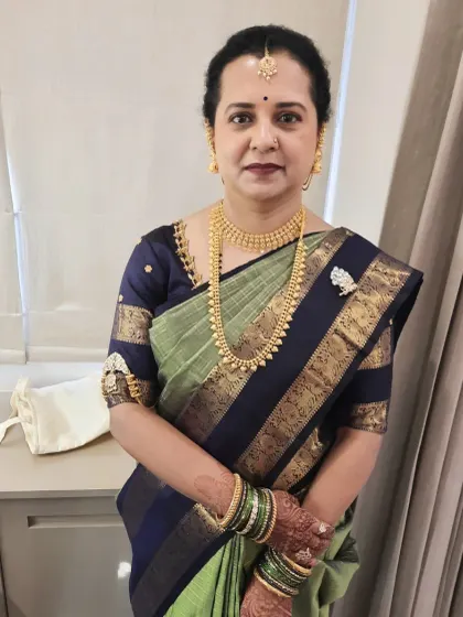 Here is the mother of the groom, looking poised and elegant for her son's Muhurtham. I applied subtle makeup that complements mature skin, focusing on a clean base and soft definition.