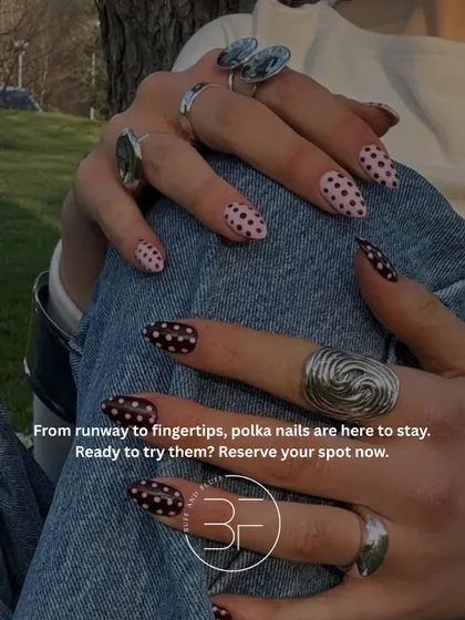 From the runway to your fingertips, polka dot nails are here to stay. This image shows a playful mix of black and pink polka dot designs.