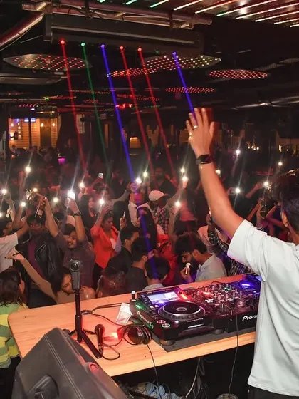 My view of the crowd at Helium, with everyone's hands in the air.