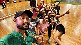 An instructor taking a selfie with his energetic class. This close bond between trainers and members is a key part of what makes our studio special.