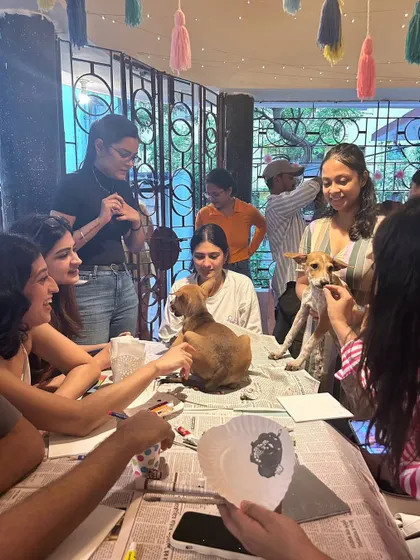 A group of participants at our Art with Shelter Puppies session in Kolkata, held at the beautiful Mrs. Wilson's Cafe.