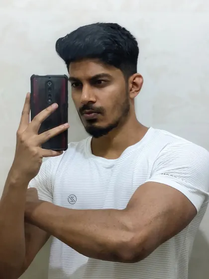 Celebrate progress, no matter how small. A bathroom selfie showing arm definition.