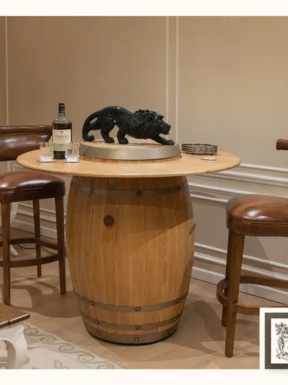 I designed this automated barrel bar for a more rustic, industrial feel. Crafted from a genuine wood barrel, the top rises to create a convenient and stylish serving station, perfect for a casual entertainment area.