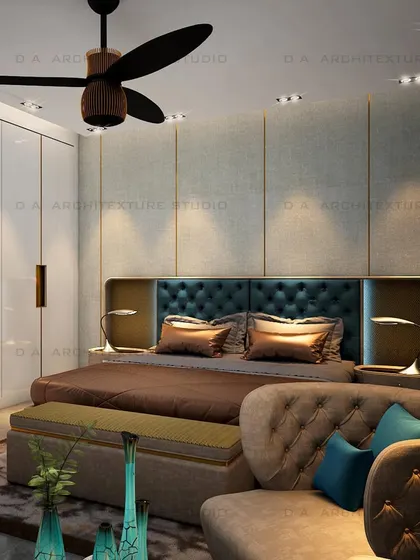 Another view of the bedroom, showing the full effect of the tufted headboard against the textured wall with brass inlay details.