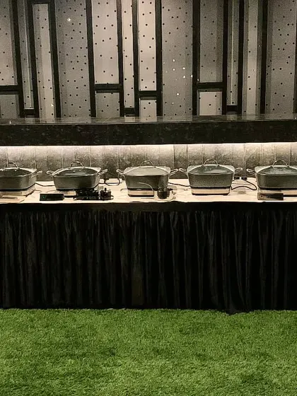 A sharp, all-black setup for a private Diwali party, creating a modern and sophisticated look.