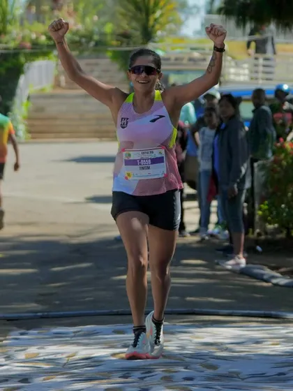 Arms raised in victory at the Ooty Ultra. A moment of pure triumph after a grueling race.