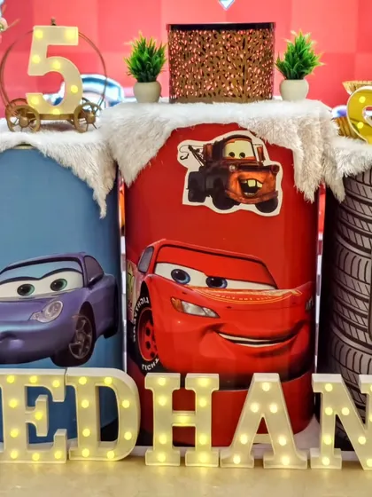 A close-up of the Cars themed pedestals, featuring Lightning McQueen, Sally, and Mater.