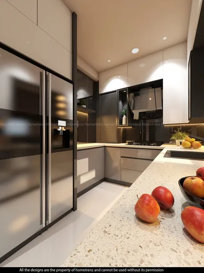 A perspective of a modern kitchen highlighting the stainless steel double-door refrigerator and high-gloss cabinets. The design focuses on integrating large appliances for a clean, uncluttered look.