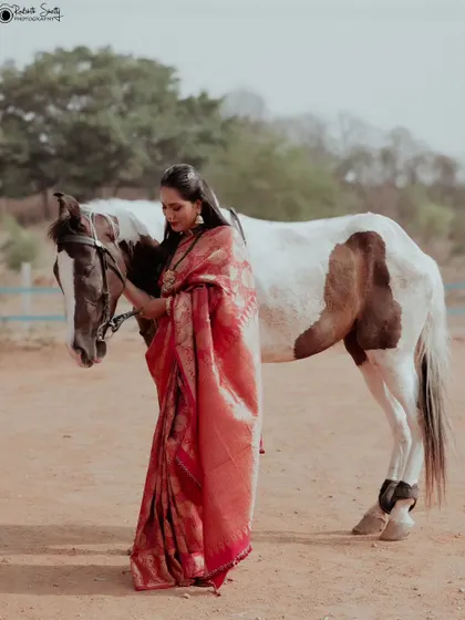 I love bringing unique concepts to life. This editorial fashion shoot combined the elegance of a traditional silk saree with the rustic beauty of an outdoor equestrian setting, creating a memorable and artistic portrait.