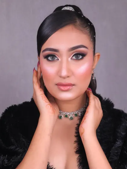 A direct, confident gaze from the model, showcasing the flawless and professional quality of our student's work.