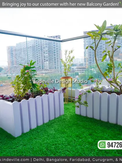 A close-up of the custom planters against the glass railing, with the city skyline in the background. This shows how I bring nature into high-rise living.
