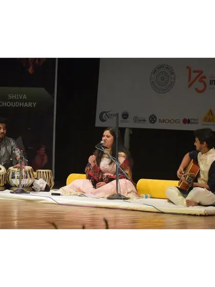 A wider shot of our trio on stage at IIT Roorkee. It shows the simple, traditional baithak setup we use even in modern auditoriums to maintain the essence of the music.