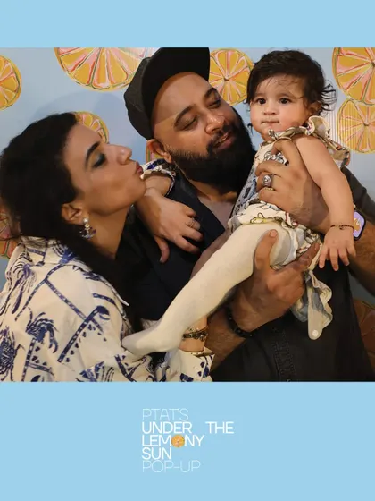 A beautiful family moment with a baby at the PTAT pop-up. Our high-quality cameras and lighting ensure even the youngest guests look great in photos.