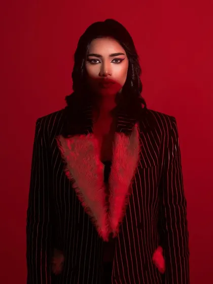 A dramatic, red-lit shot from the vintage Hollywood editorial.