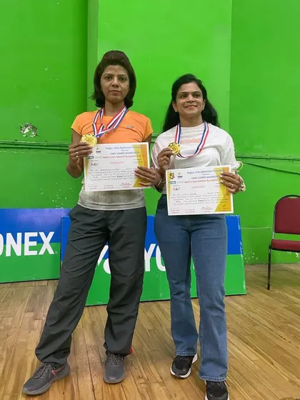 Double the success. Our player Bhagyalaxmi Kulkarni and her partner proudly show off their gold medals from the Palghar Zillha Badminton Foundation Tournament.