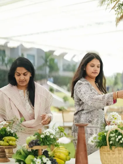 My team and I arranging the fresh fruit and floral centerpieces for the brunch. We believe in a hands-on approach to ensure every detail is perfect.