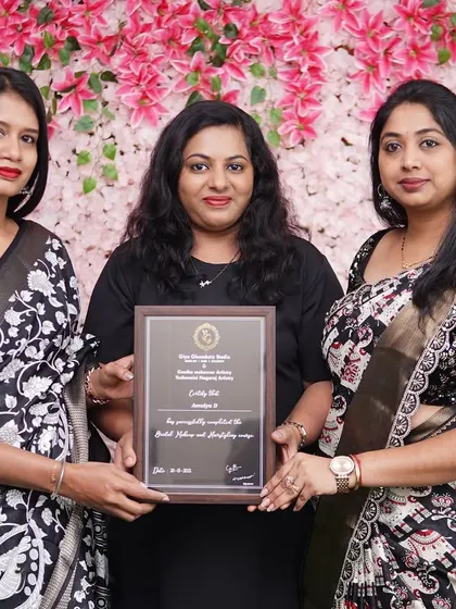 Presenting the final certificate to a student from Batch 15. Each certificate represents a new professional entering the bridal industry.