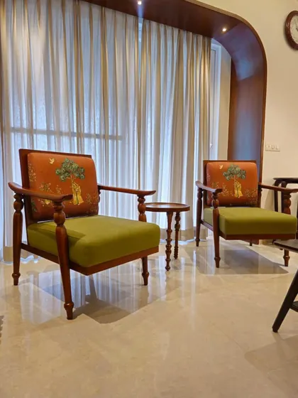 Adult friendships are just inviting people over, sitting in chairs like this, and collectively complaining about back pain. Custom armchairs with beautiful upholstery.