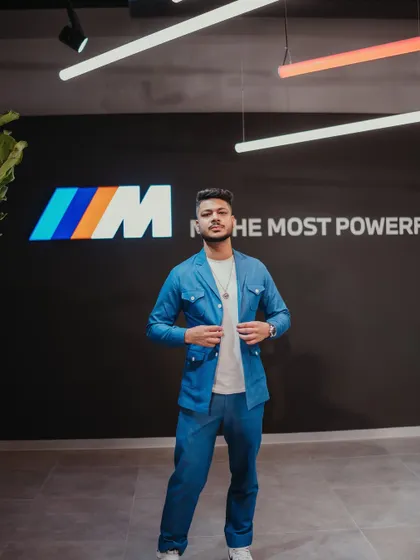 Standing in front of the iconic 'M' logo at the BMW event. Performing for their performance division was a perfect fit, as I always aim to deliver a high-performance show.