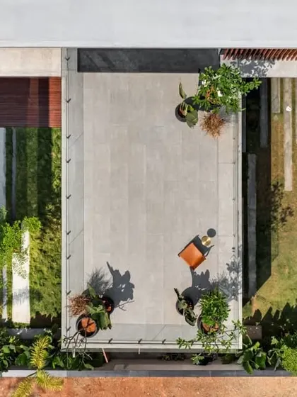An aerial top-down view of the Long House, revealing the geometric layout of its courtyards, terraces, and pathways.