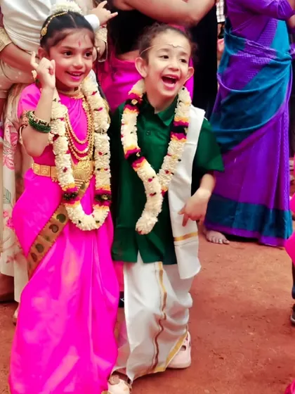 Happy faces all around. Dressed in beautiful traditional outfits, these two friends share a joyful moment, showcasing the cultural diversity and friendships in our studio.