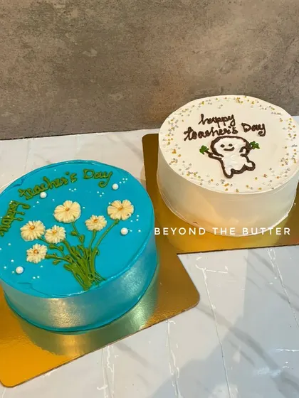 Two of my minimalist bento cakes for Teacher's Day, one with a floral design and the other with a cute cartoon.