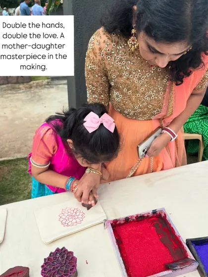 There is nothing more special than seeing generations connect through art. Here, a mother and daughter work together to create a beautiful printed pouch at a wedding celebration. These are the moments of pure love and shared creativity that I cherish.