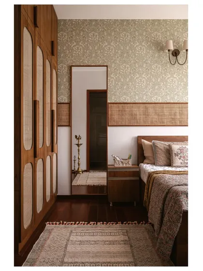 A duplicate of image 22, showing the full view of the guest bedroom with its cane-detailed wardrobe.