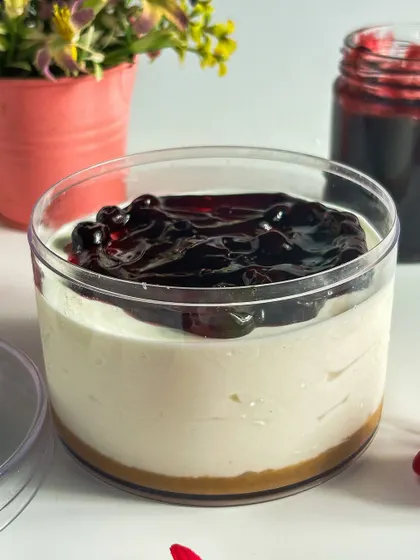 A close-up of the blueberry cheesecake tub, showcasing the glossy, fruit-packed compote. I make all my fruit toppings from scratch to ensure the best flavor.