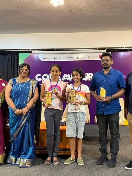 The winning team and their mentors on stage at the Codeavour 6.0 competition. This group photo captures the collaborative spirit and shared success of our ROBO-G team.