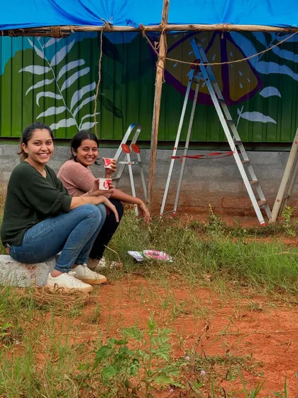 Taking a much-needed tea break with my assistant during a challenging mural project. I teach the importance of teamwork and taking moments to rest and recharge during long, physically demanding jobs.