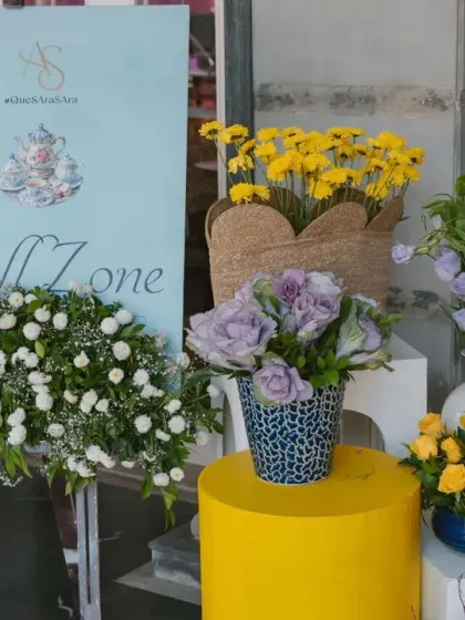 A "Chill Zone" sign welcomes guests to a relaxed area at the Haldi, styled with fresh flowers in blue and yellow.