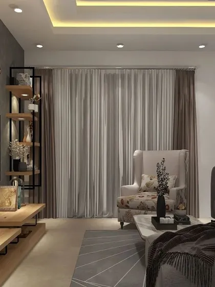 This view shows the overall ambiance of the living room, with its textured grey wall, sheer curtains, and comfortable seating arrangement. It’s a perfect example of a modern, sophisticated relaxation zone.