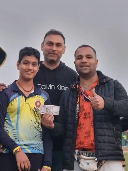 Awarding a young player for his performance during a tour match in Delhi. Recognizing effort motivates players to do even better.