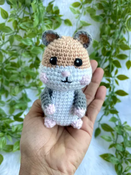 This was my first time making a hamster, and I'm totally in love. This little guy is so round and cute, with tiny pink paws and rosy cheeks.