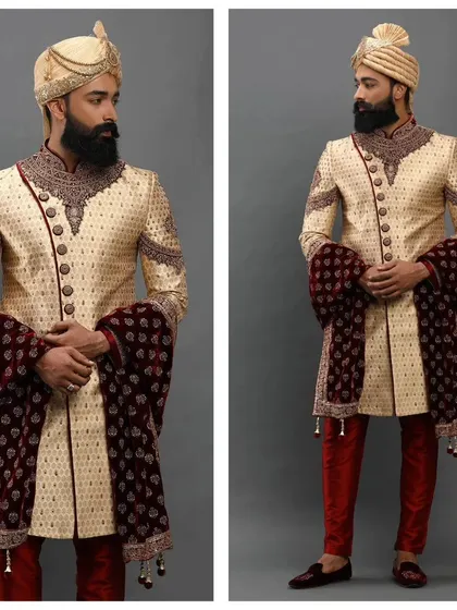 A beige and maroon embroidered sherwani. This pre-loved outfit is a classic choice for a groom, offering a rich and royal look.