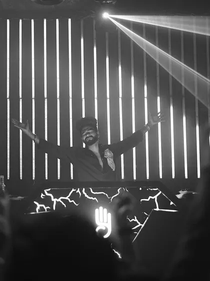A dramatic black and white shot from my set at Carpediem, Hyderabad, with lights beaming from the ceiling.