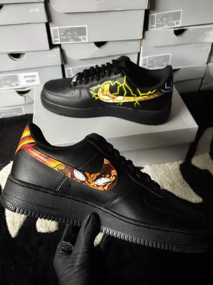 Another angle of the inner swooshes, showcasing the dynamic anime art on the black sneakers.