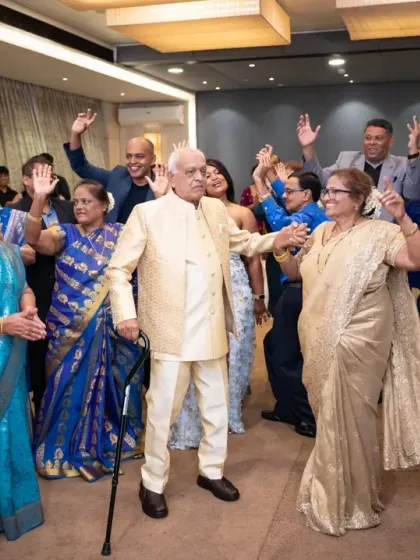 The happy couple on the dance floor, surrounded by their friends and family, celebrating 50 years of love and partnership.
