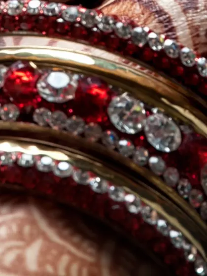 Another look at the beautiful red bridal bangles, sparkling with stones. We appreciate the importance of every piece of traditional jewelry in completing the bridal look.