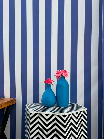 From concept to execution in just 42 hours. This St. Tropez inspired decor in Ahmedabad involved transforming a bungalow with custom-painted walls, fruit-based installations, and unique props, all on a tight deadline.