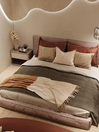 An overhead view of a bedroom where the false ceiling design flows down the wall, creating a unique, continuous wave of light.