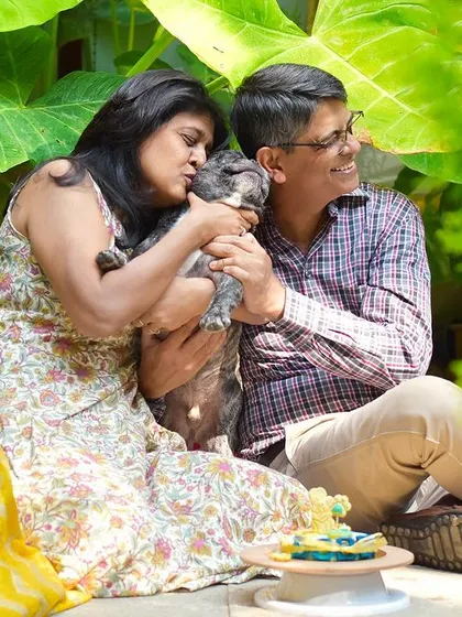 A candid moment of love and cuddles during a birthday celebration. These are the sweet, in-between moments that make a photoshoot so special.