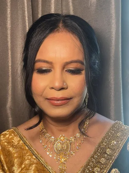 A close-up of the makeup for my client, Rama. I used a dash of shimmer and a smudged liner to define her eyes, creating a remarkable glow for her nephew's wedding.