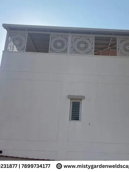The full exterior view of the building, showing how the CNC designer frames on the top floor create a distinctive and stylish architectural feature.