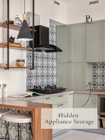 A hidden appliance garage with a lift-up or pocket door is perfect for stowing away mixers and toasters. This keeps your countertops clear and your gadgets dust-free but still easily accessible.